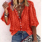 Brightly colored printed women's blouse with button front by Lumina Wear, featuring casual style and vibrant pattern.