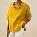 Lumina Wear Clara relaxed fit V-neck top in soft fabric, featuring a casual style and comfortable fit.