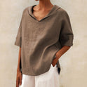 Lumina Wear Clara relaxed fit V-neck top, soft fabric, stylish casual shirt, light-colored with subtle detailing.