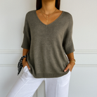 Lumina Wear Clara relaxed V-neck women's sweater with minimalist design, soft knit fabric and casual fit.