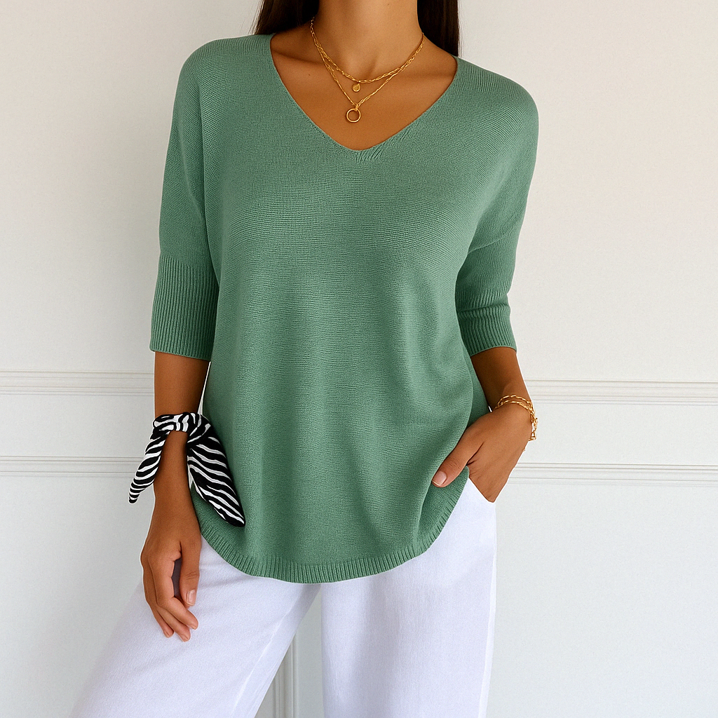 Light gray Lumina Wear Clara relaxed V-neck sweater with minimalist design, soft knit fabric, and comfortable fit for women.