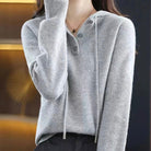 Lumina Wear Elise cozy v-neck hooded sweater with button details, soft knit fabric and relaxed fit for casual comfort.