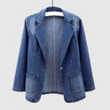 Light wash denim jacket by Lumina Wear featuring an elegant profile and stylish fit, shown on a model in a casual setting.