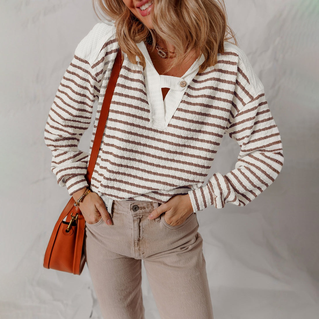 Lumina Wear Elise soft striped textured V-neck sweater with buttoned strap, cozy knit, stylish design, perfect for casual wear.