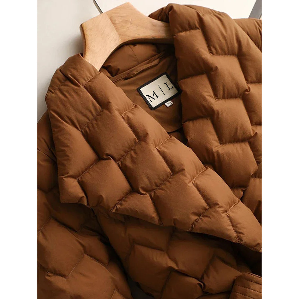 Lumina Wear Elise tailored geometric down puffer jacket with belted waist, featuring a sleek, quilted design and modern silhouette.