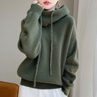 Lumina Wear Elise relaxed fit merino wool sweater with tailored hood, showcasing soft fabric and casual style.