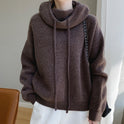 Lumina Wear Elise ultra-soft relaxed fit merino wool sweater with a tailored hood, shown in a cozy, comfortable fit.