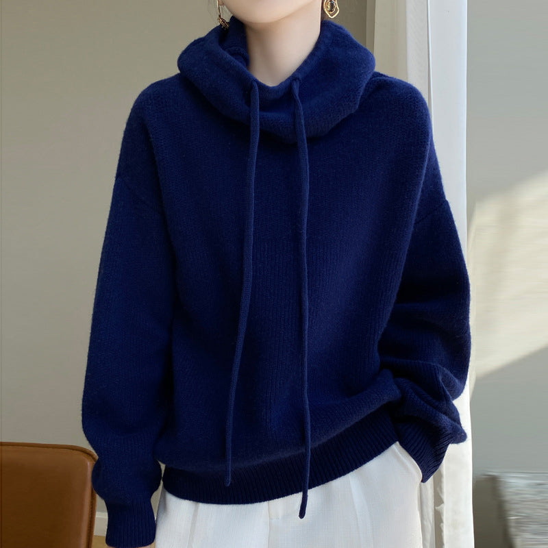 Lumina Wear Elise ultra-soft merino wool sweater with relaxed fit and tailored hood, shown in a cozy, casual style.