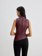 Ella sleeveless high neck tank top for women by Lumina Wear, shown in a stylish black fabric, close-up of neckline and fit.