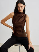 Lumina Wear Ella sleeveless high neck tank top for women, shown in a stylish fit with a high neckline and sleeveless design.