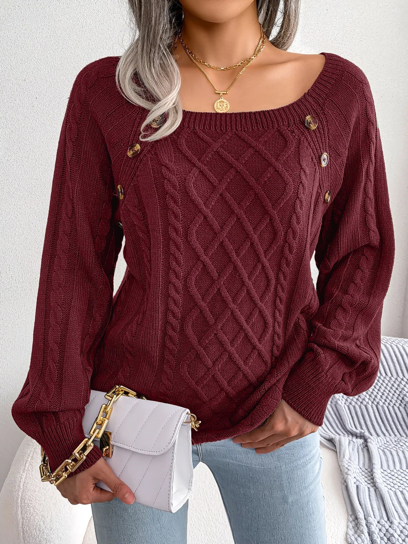 Lumina Wear Emilia cozy cable-knit women's sweater with relaxed fit and button accents, perfect for casual and comfortable wear.