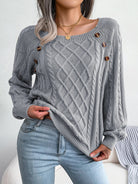 Lumina Wear Emilia cozy cable-knit women's sweater with relaxed fit and button accents, perfect for casual comfort.