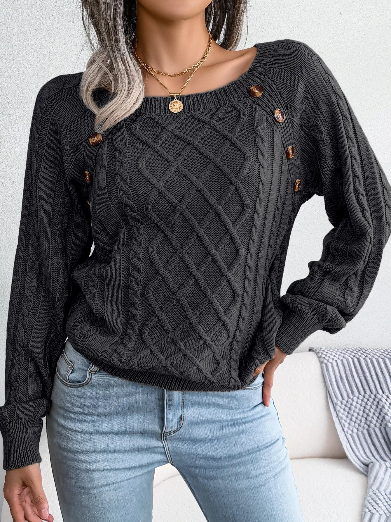 Lumina Wear Emilia cozy cable-knit women's sweater with relaxed fit and button accents, perfect for casual comfort and style.