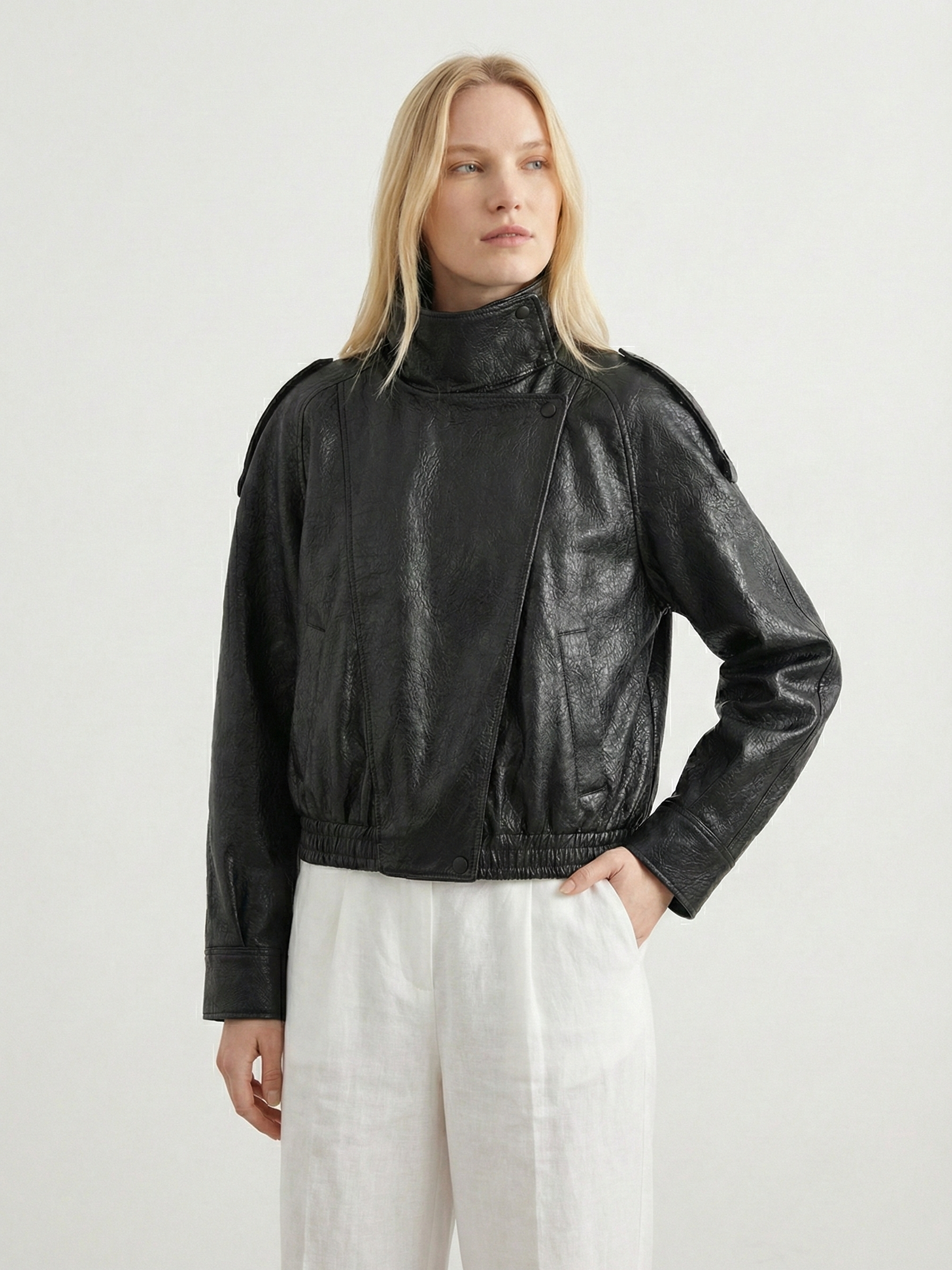Women’s oversized structured high-neck faux leather jacket by Lumina Wear, featuring a sleek design and bold silhouette.