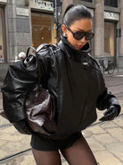 Lumina Wear Felicia oversized structured high-neck faux leather jacket for women, featuring a modern, bold design and sleek black finish.