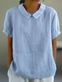 Light beige Fiona linen blouse with a Peter Pan collar from Lumina Wear, featuring a relaxed fit and elegant, casual style.