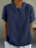 Linen blouse with Peter Pan collar, Fiona by Lumina Wear, shown in soft beige fabric with long sleeves and button detail.
