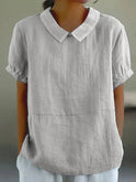 Linen blouse with Peter Pan collar by Lumina Wear, featuring a charming, lightweight design and soft fabric texture.