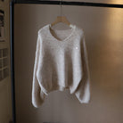 Lumina Wear Fiorentina soft draped vintage V-neck sweater with a comfortable fit, shown on a model in a cozy, relaxed setting.