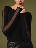 Lumina Wear Florence mesh sleeve top with relaxed fit, featuring stylish sheer mesh sleeves and casual t-shirt style.