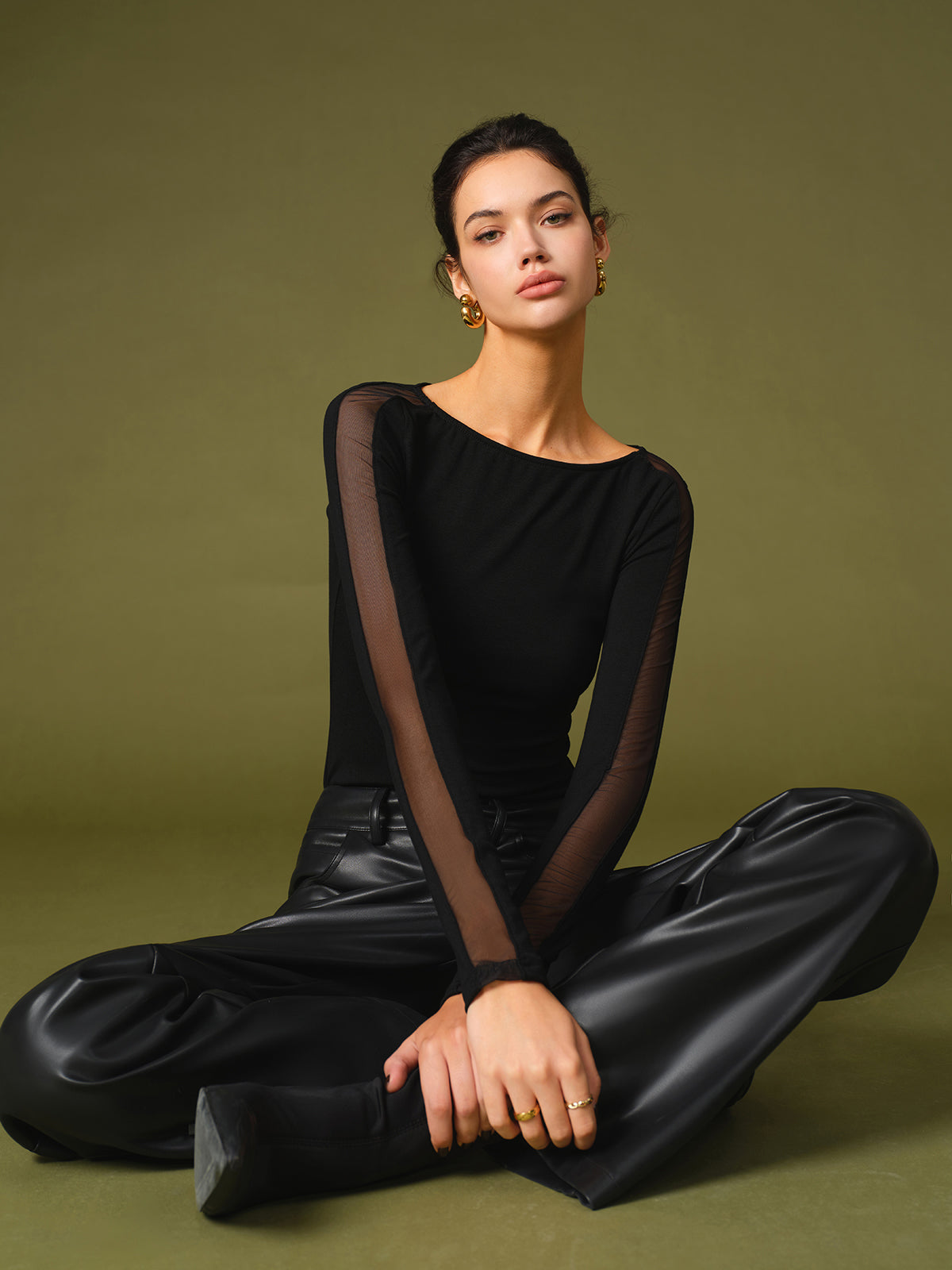Lumina Wear Florence mesh sleeve top with relaxed fit, featuring stylish mesh sleeves and casual cotton fabric.