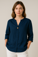 Light blue Gabrielle relaxed fit blouse with button details from Lumina Wear, featuring a casual, stylish design.