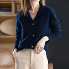 Black high-neck cardigan sweater with stylish buttons from Lumina Wear, featuring a sleek, elegant design and cozy fit.