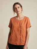 Light beige Lumina Wear Grace relaxed linen blouse with button details, featuring a loose fit and casual style.