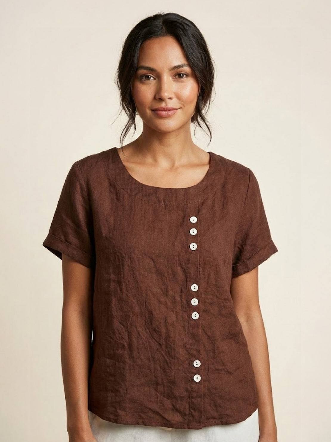 Light beige relaxed linen blouse with button details from Lumina Wear, featuring a casual fit and classic design.