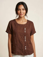 Light beige relaxed linen blouse with button details from Lumina Wear, featuring a casual fit and classic design.