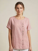 Light beige Lumina Wear Grace relaxed linen blouse with button details and a loose fit, displayed on a mannequin.