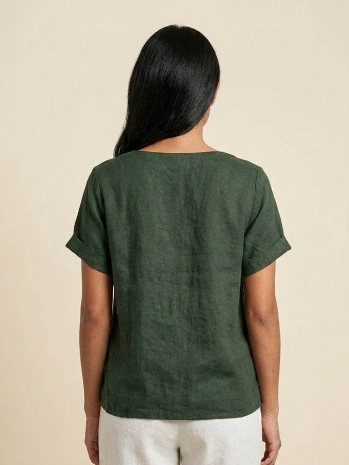 Lumina Wear Grace relaxed linen blouse with button detail, featuring a comfortable fit and stylish design for casual wear.