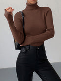Lumina Wear Hailey minimalist black turtleneck sweater, sleek winter top with a fitted design and smooth fabric.