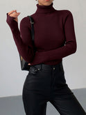 Lumina Wear Hailey minimalist black turtleneck sweater, sleek winter top with a fitted design, perfect for elegant cold-weather outfits.