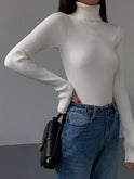 Lumina Wear Hailey minimalist black turtleneck sweater, sleek winter top with a fitted design and soft knit fabric.