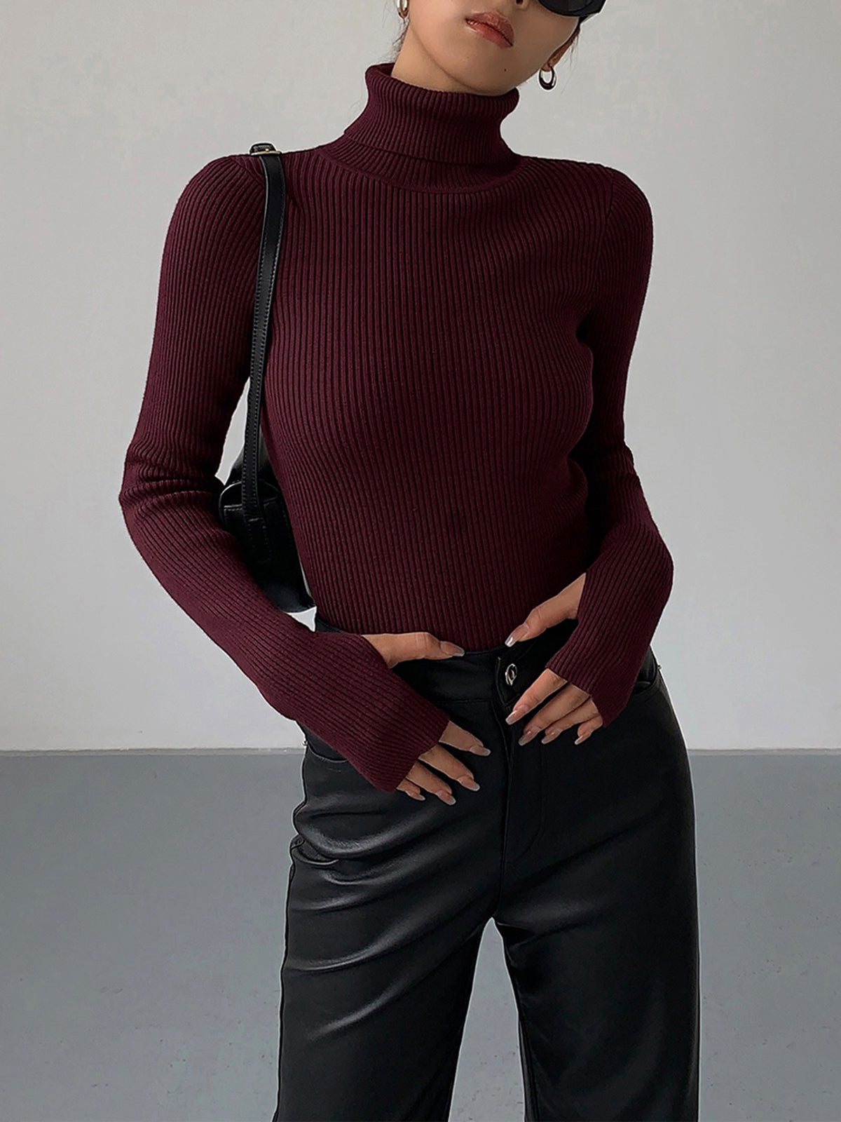 Lumina Wear Hailey sleek minimalist black turtleneck top for winter, featuring a fitted design and smooth fabric.