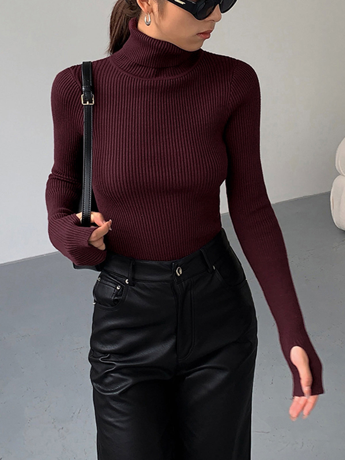 Lumina Wear Hailey sleek minimalist turtleneck top for winter, shown in black with a fitted, smooth fabric design.