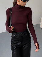 Lumina Wear Hailey sleek minimalist turtleneck top for winter, shown in black with a fitted, smooth fabric design.