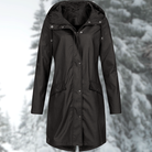 Lumina Wear Isabella adjustable hood raincoat with snap buttons and streamlined fit, perfect for rainy weather.