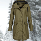 Lumina Wear Isabella adjustable hood raincoat with snap buttons, streamlined fit, perfect for rainy weather.