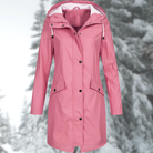 Lumina Wear Isabella adjustable hood raincoat with snap buttons and streamlined fit, perfect for rainy weather protection.