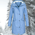 Lumina Wear Isabella adjustable hood raincoat with snap buttons and streamlined fit, suitable for wet weather protection.