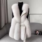Isabella Lumina faux fur vest with leather trim, belted waist, and sleek silhouette displayed on a model.
