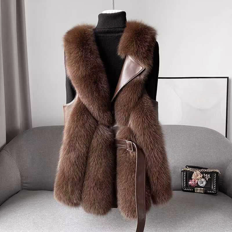 Lumina Wear Isabella belted faux fur vest with leather trim, showcasing a sleek silhouette and stylish design.