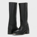 Black leather knee-high orthopedic boots with retro style from Lumina Wear, styled with a classic, vintage-inspired design.