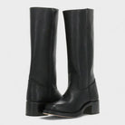 Black leather knee-high orthopedic boots for women with retro style, featuring a classic design by Lumina Wear.