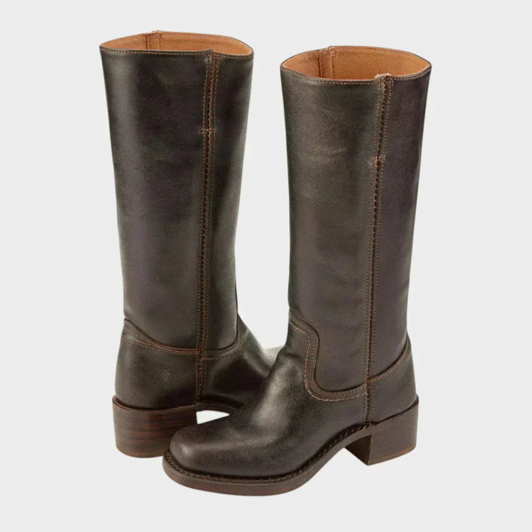 Black leather knee-high orthopedic boots for women with retro style from Lumina Wear, featuring a sleek and classic design.
