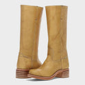 Black leather knee-high orthopedic boots with retro style by Lumina Wear, featuring a sleek design and sturdy heel.
