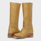 Black leather knee-high orthopedic boots with retro style by Lumina Wear, featuring a sleek design and sturdy heel for women.