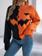 Lumina Wear women's knit pullover featuring bold orange and black colors with a Jack-o'-Lantern design.
